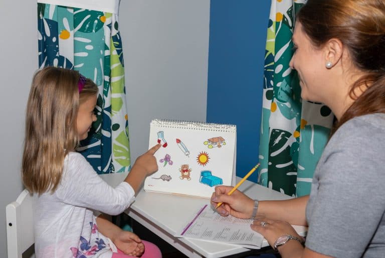 Child playing during a pediatric therapy session at ATWC
