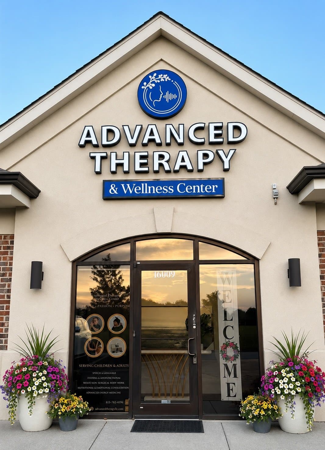 The front entrance of Advanced Therapy and Wellness Center, with flower planters on either side of the door